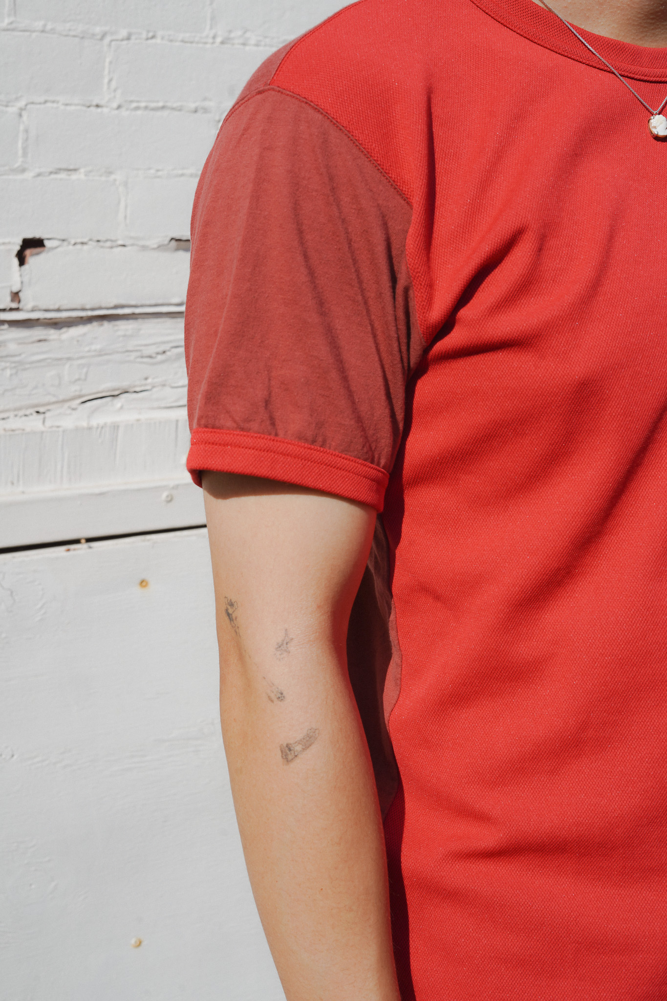 COMME des GARÇONS Homme Plus Red Panelled T-Shirt --One of my favorite things that COMME des GARÇONS does is their use of panelling with different fabrics and patterns combined together to make super unique pieces. I was on the hunt for a more formal dress shirt with that sort of design while in Japan but had no luck finding any that fit me or were understated enough for wear in a work environment. I came across this piece at 10tow in Shibuya and knew I had to get it when I tried it on. --Even though it wasn't the dress shirt that I envisioned myself purchasing, I still love this shirt and all its details - the mixing of polyester and cotton panels, ringer sleeve detail, and how the two shades of red look next to each other. I had been looking at somewhat similar shirts on Grailed for a while and decided that this one was a bargain, given not only its price but also its condition. I believe it is from S/S 2003 according to the label.  --I am not sure if this means I now own archive CDG. Acquired August 24, 2025. 