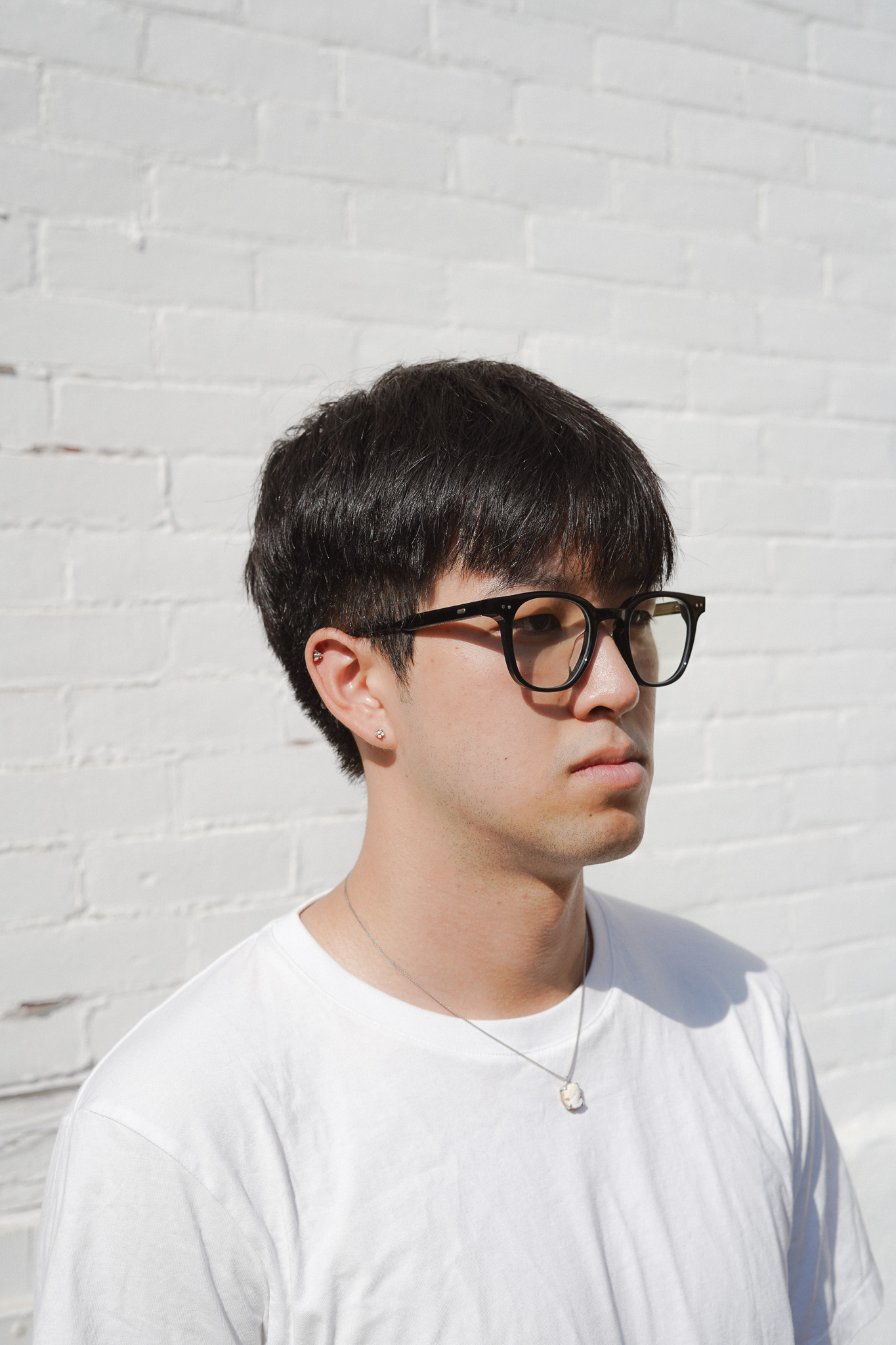 Gentle Monster Lutto 01 --These glasses were purchased via the most interesting shopping experience I have ever undergone. They are from ZZER, a secondhand designer consigment chain in China. When you enter, (if you have a bag) you are directed to a locker area to stow it. Then you are given gloves so as to keep all the items clean. The gloves have thumb and index finger holes for easy phone use, which is important because every item has a QR code, that when scanned takes users to the listing of the item on their app, complete with information about price, condition, what sort of original packaging the item comes with etc. The place was built like a warehouse with rows of metal racks that housed an obscene number of designer bags (all in little cubbies tucked sideways), clothes, and cases of accessories.  --I tried this pair on at the Shenzhen location. They also had a pair of the Margiela collaboration (M113 I believe) in stock and I was very tempted to get those. Virtually no one who voted on my Instagram poll (between these and the Margiela) liked the Margiela on me so I ended up not getting them. I passed on this pair my first visit but I went back the next day to purchase them. The main reason why I went back for them was because this particular model is not made anymore. The other (less important) reason was beccause they were priced slightly under retail. --The lenses on these glasses are not prescription. Acquired September 11, 2025. 