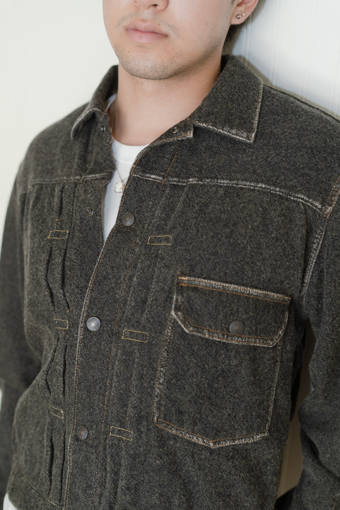 Kapital Twill Aging-Wool 1st Jacket - Faded Charcoal --This is my first Kapital piece. I bought it at the Tokyo Naked Store during my first trip to Japan. I knew I wanted to find something in the neighborhood of a denim jacket during my time there, and when I came across this piece, I knew it was the one. The sales associate definitely planted some seeds in my head to get me to buy it - he said it was the only one of its size left in stores (my size was in stock online) (I guess I couldn't have it shipped to me anyways because we were only in Japan for a couple more days) but I do not blame him one bit.  --Modeled after the Levi's Type 1 jacket, it has all the characteristics of the jean jacket I was looking for, but with a softer touch and less country Americana energy that fits better into my style. I love the contrast stitching around all the hems that give it this sort of aged look without being worn. I am scared to get it wet because it is made of wool. One time I was caught in the rain with it without an umbrella. Luckily I escaped and the jacket is fine. I hope I never have to wash it. On that trip, Suanna ended up getting the same jacket but in the red colorway in Kyoto. I have had this jacket since December 2024. 